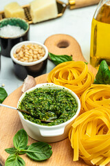 Italian raw Pasta tagliatelle with pesto. Restaurant menu, dieting, cookbook recipe top view