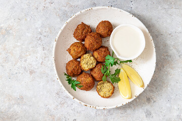 Chickpeas falafel with tahini sauce.