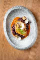 Fried fish fillet. Cod with sauce and herbs