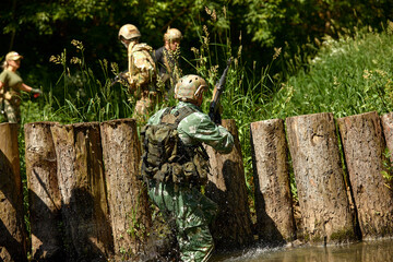Full military experience - One day commando - running through the water with automatic rifle replica