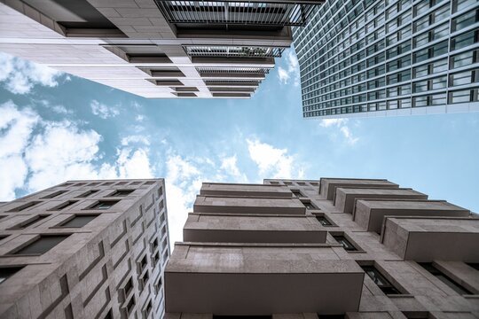 Undershot of skyscrapers with a cloudy sky background