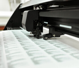 plotter cutting stickers typography polygraphy machine black labels contour cutting
