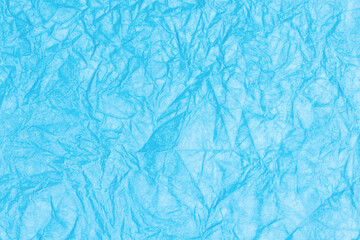 Crumpled paper abstract background texture. Blue color. Full frame