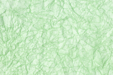 Crumpled paper abstract background texture. Green color. Full frame
