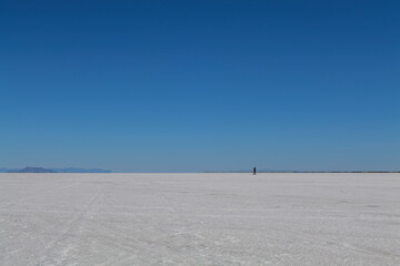 Obraz premium Salt Flats in Utah. Salt Flats Landscape. Blue Sky and Snow-White Salt Soil. Bonneville Salt Flats. High quality photo