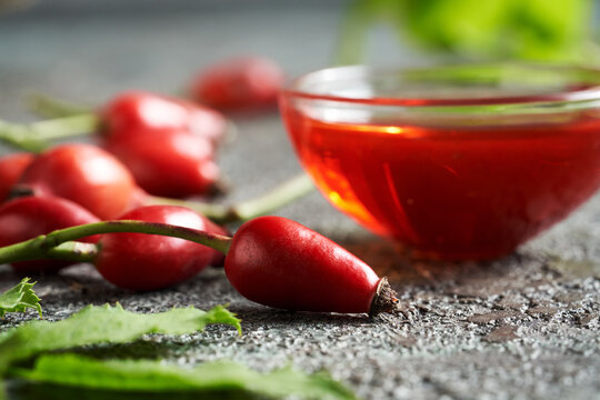 Rosehip Berry With Rose Hip Seed Oil In The Background