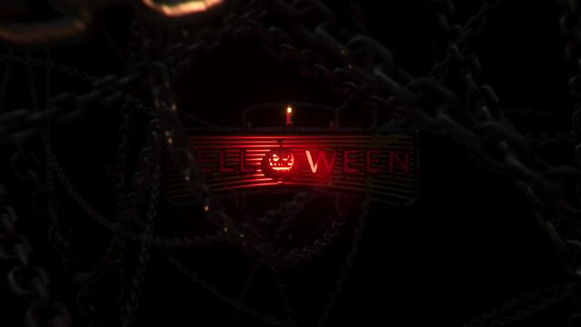Halloween red inscription and pumpkin inside, camera raiding between the chains, black background