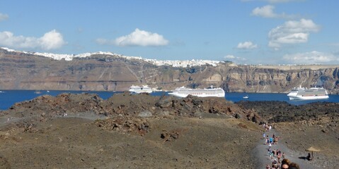 Santorini's hike on the Nea Kameni volcano with Santorini , Fira and cruise ships in the...