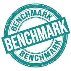 BENCHMARK text written on blue round stamp sign