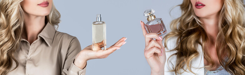 Woman holding a perfumes bottle. Beautiful girl using perfume. Woman with bottle of perfume. Woman...