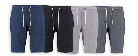 Collection of men's Bermuda shorts on a white background. Isolated image on a green background....