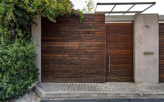 A contemporary house external entrance wooden door. Athens, Greece.