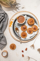 Homemade cookies with a generous dollop of Salted Caramel and pecan nut