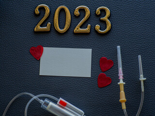 2023, medicine and donating blood concept. Close up view photo of 2023 and place for text on dark...