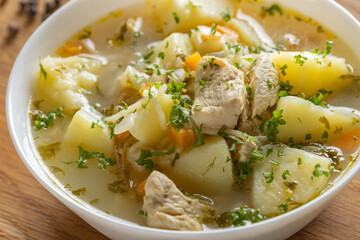 Chicken soup with potatoes and noodles