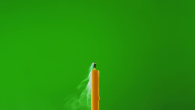 fire flame glowing candle on windy on green screen background of slow motion