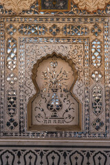 Detail and close-up view of the exquisite architectural work on the walls of the amber palace in Jaipur.