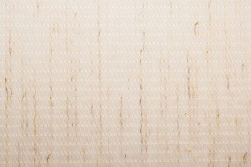 Beige fabric background. A chunky textured fabric with a pattern