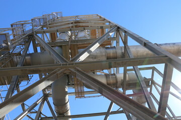 view up to industrial exhaust gas stacks with steel structure