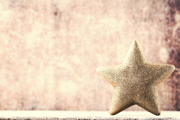 Christmas star with Santa hat. Vintages background.