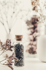 Dried lavender flowers with bottle. Homeopathy background.