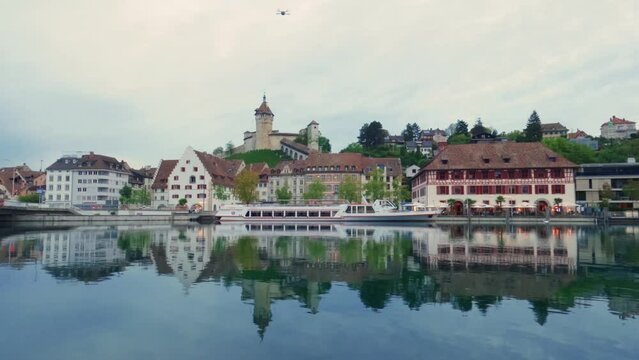 Timelapse of embankment in Schaffhausen during sunset with Munot Fortress