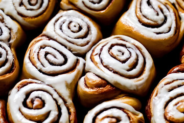 photo of cinnamon rolls, a sweet baked dessert, filling pastry