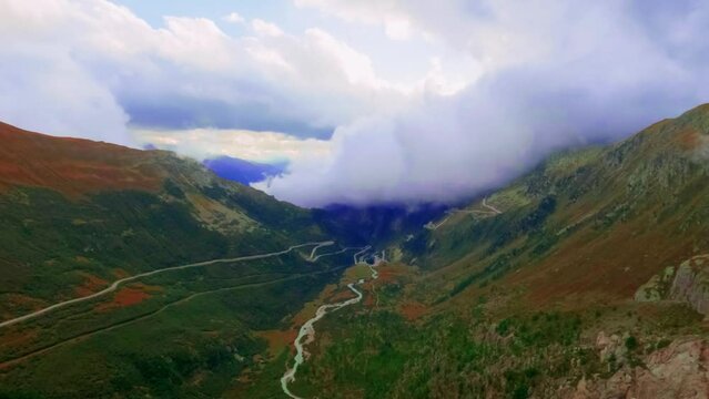 Timelapse View at Goms valley, Rotten river and rolling clouds going from behind the mountain