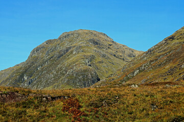 Rocky Mountain Top Against a Blue Sky in the Scottish Highlands