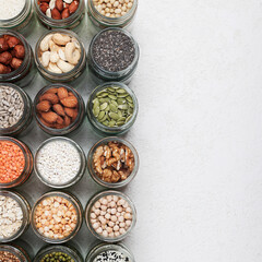 Vegan source of protein. an assortment of healthy vegetarian food. top view of seeds, nuts, peas, rice, oatmeal, lentils on white background square