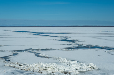 Cracked lake ice on a clear sunny very cold day