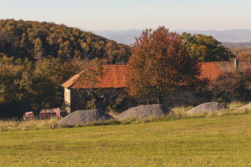 Old peasant house in beautiful natural surroundings.Sunny day in autumn.