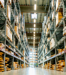 High racks in the aisle in a large warehouse vertical view