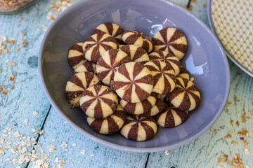 Fototapeta premium Sweet chocolate brownies on rustic wooden table with flakes