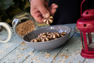 Woman hand holding a sweet chocolate brownies