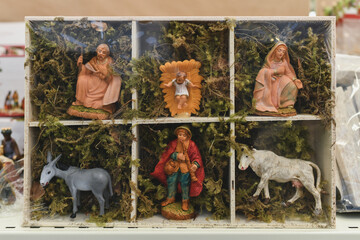 Figurines for the nativity scene of the birth of christ on a shop window