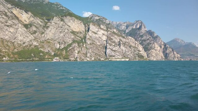 Panning over Garda lake in Italy in summer sunshine 4K stock video