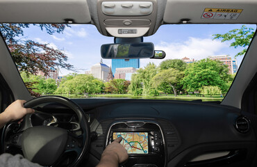 Driving while using GPS towards the Boston Public Garden, USA