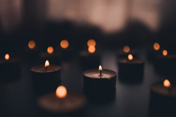 Obraz na płótnie Canvas Burning scented candles in dark at night in room