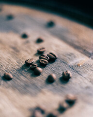 Coffee beans on a whiskey barrel.