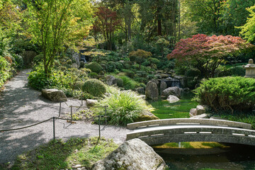 Small but beautiful japanese garden in Wurzburg with artificial creek, waterfalls, decorative lanterns and bridge