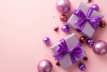 New Year concept. Top view photo of purple present boxes with ribbon bows pink violet baubles and...