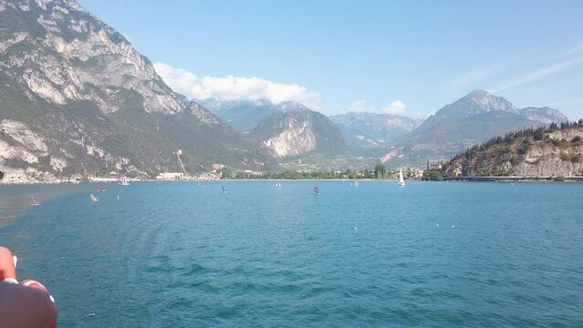 Sailing on Garda lake in Italy in summer sunshine 4K stock video