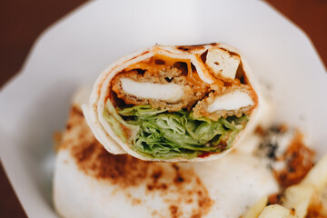 Burrito with grilled chicken and vegetables pita bread, shawarma