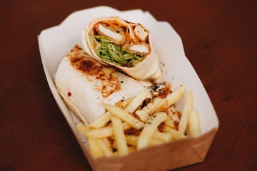 Burrito with grilled chicken and vegetables pita bread, shawarma