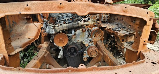 old rusty engine, Old rusted torched car, abandoned car on highway mumbai.