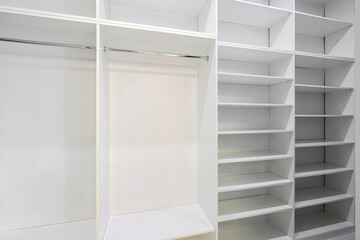 Open wardrobe with shelves in the room