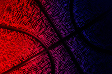 Closeup detail of basketball ball texture background. Neon banner art concept. Horizontal sport theme poster, greeting cards, headers, website and app
