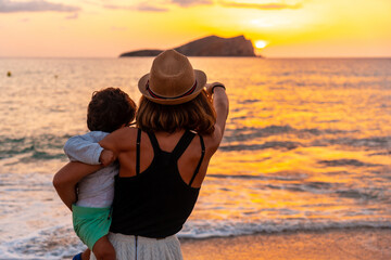Tourist hat at sunset in Cala Comte beach on the island of Ibiza. Balearic, vacation concept