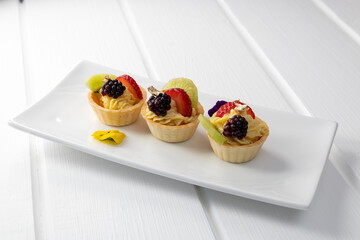 gourmet type food decorated with tropical fruits and pastry cream, cake as dessert, wallpaper